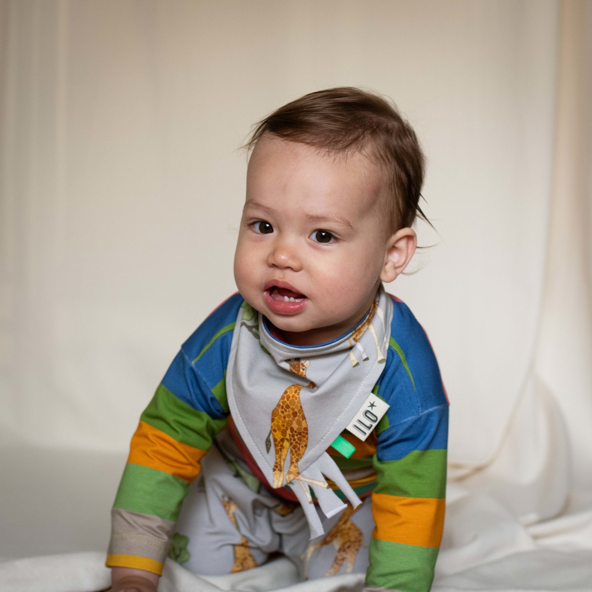 Child wearing giraffe bandana