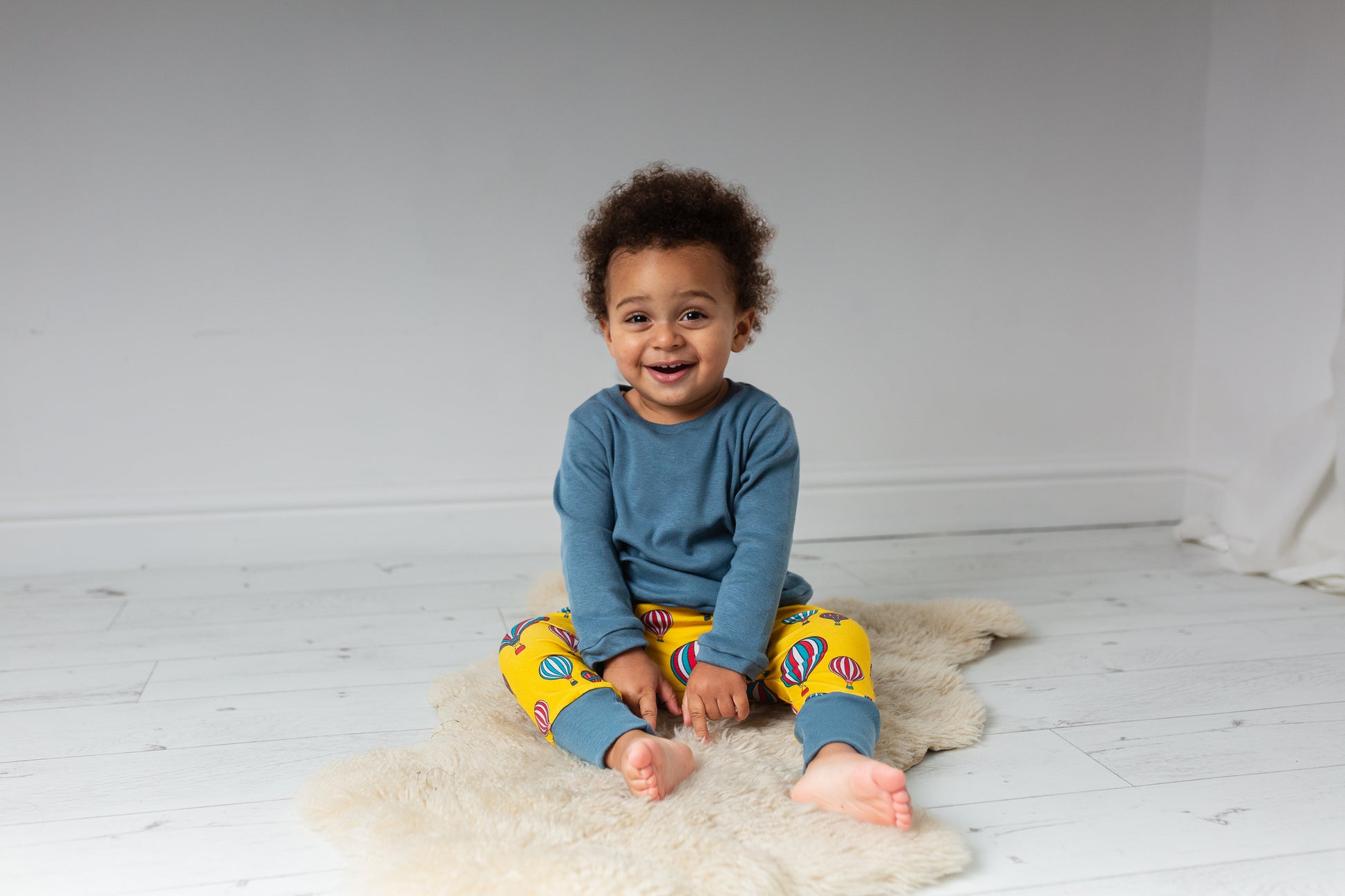 child wearing Organic yellow hot air balloons harem trousers