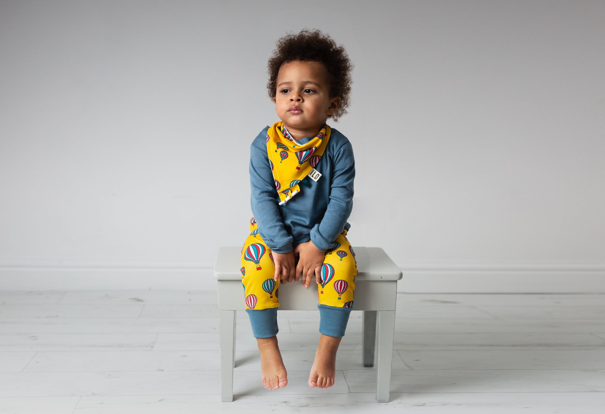 child wearing Organic yellow hot air balloons harem trousers