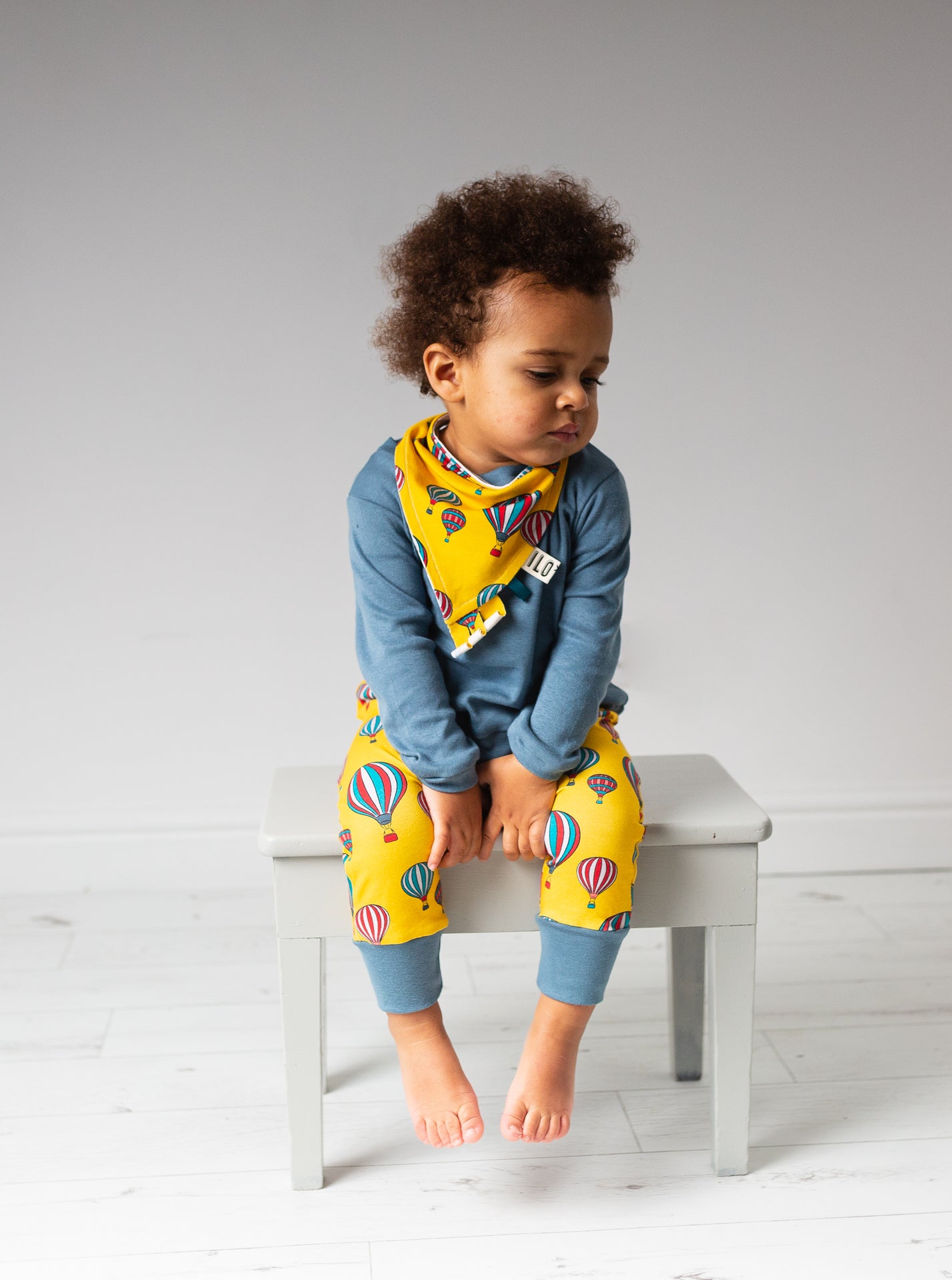 child wearing Organic yellow hot air balloons harem trousers