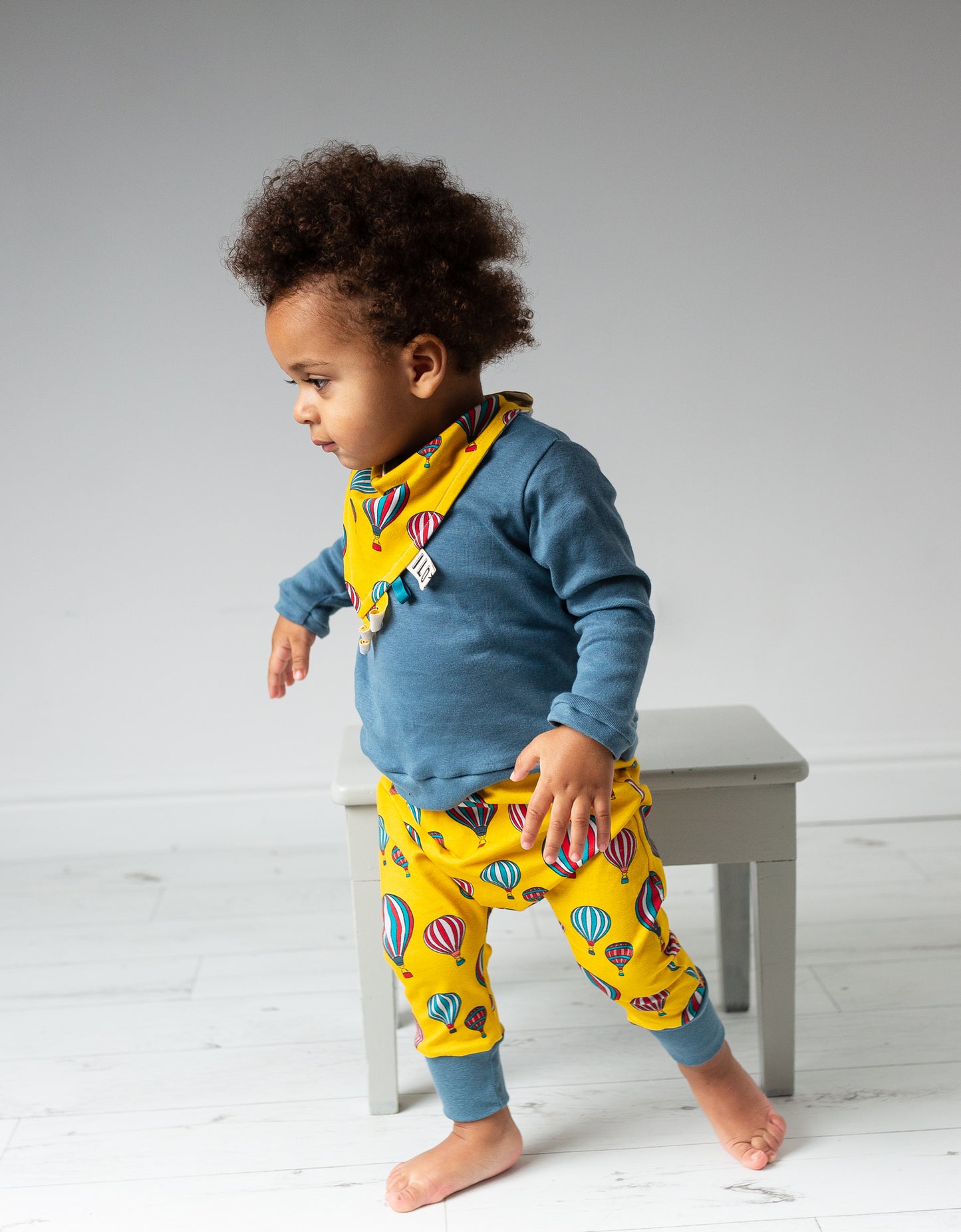 child wearing Organic yellow hot air balloons harem trousers